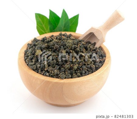 Heap of dried green tea isolated on white background Heap of dried green tea isolated on white background 82481303
