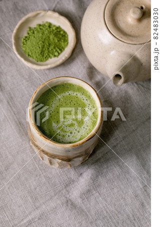Traditional hot green tea matcha in ceramic cup 82483030