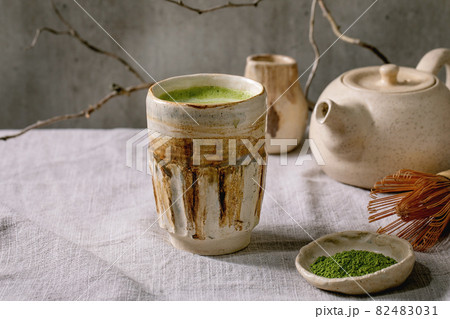 Traditional hot green tea matcha in ceramic cup 82483031