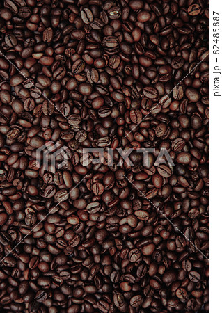 Aromatic coffee beans with background. Vertical image Aromatic coffee beans with background. Vertical image 82485887