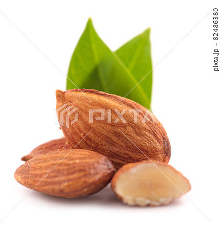 Group of almonds with leaves isolated on white background 82486380