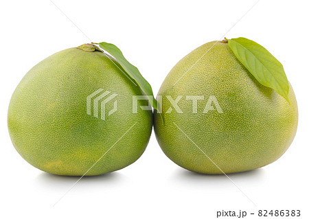 Pomelo citrus fruit with leaves isolated on white background. Clipping path Pomelo citrus fruit with leaves isolated on white background. Clipping path 82486383