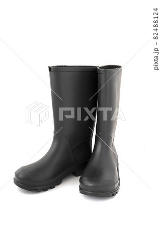 Pair of black high rubber boots, rain boots isolated on white Pair of black high rubber boots, rain boots isolated on white 82488124