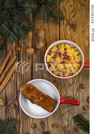 Traditional Christmas dinner in Czech Republic - carp fillet with potato salad Traditional Christmas dinner in Czech Republic - carp fillet with potato salad 82490596