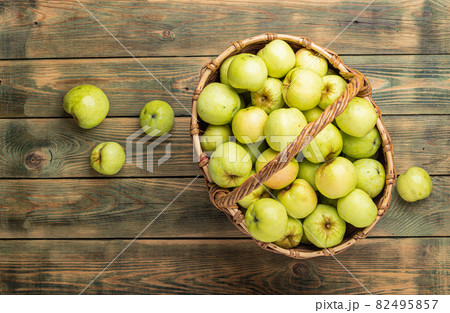 Apples in a basket over a wooden background. Apples in a basket over a wooden background. 82495857