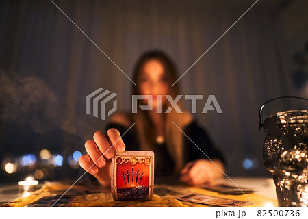 Woman reading tarot cards in spiritual room. Woman reading tarot cards in spiritual room. 82500736