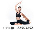 Beautiful sporty woman doing advanced yoga practice on white bac 82503852