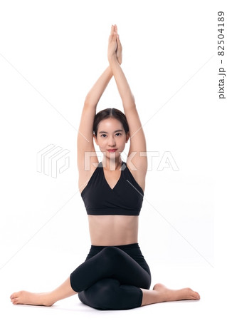 Beautiful sporty woman doing advanced yoga practice on white bac Beautiful sporty woman doing advanced yoga practice on white bac 82504189