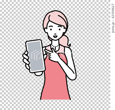 立ってスマートフォンを指差してこちらに向けて見せているドレスの女性 82509827