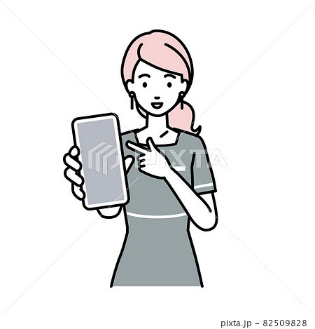 立ってスマートフォンを指差してこちらに向けて見せているエステ店員の女性 立ってスマートフォンを指差してこちらに向けて見せているエステ店員の女性 82509828