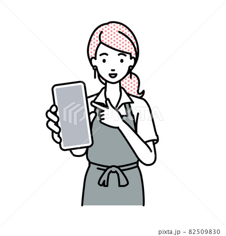 立ってスマートフォンを指差してこちらに向けて見せているカフェ店員の女性 82509830