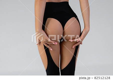 Faceless seductive woman with hands on buttocks Faceless seductive woman with hands on buttocks 82512128