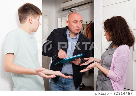 Debt collector and worried woman and teenage son Debt collector and worried woman and teenage son 82514467