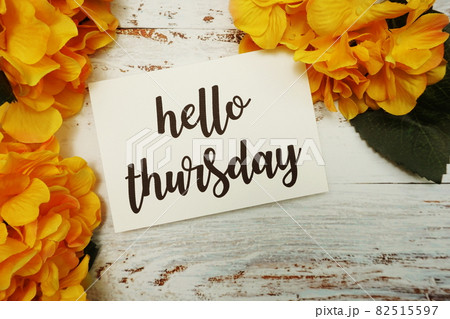 Hello Thursday Card with Blooming flower on wooden background 82515597
