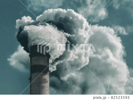 Environmental pollution, environmental problem, smoke from the chimney of a plant or thermal power plant against the sky 82523593