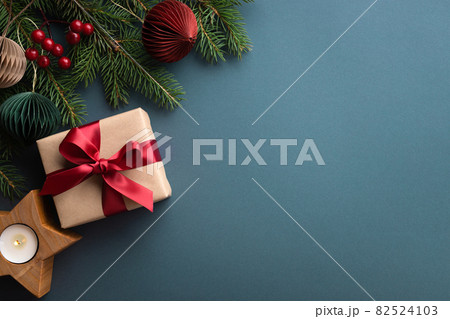 Dark turquoise background with Christmas gift box. 82524103