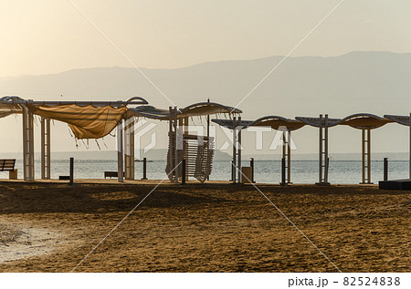 Equipped Beach on the Dead Sea with salt visible on the shore Equipped Beach on the Dead Sea with salt visible on the shore 82524838