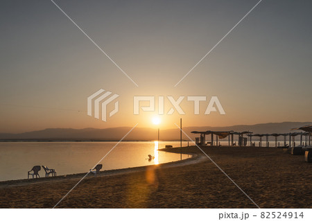 sunrise on the Dead Sea overlooking the beach and water 82524914