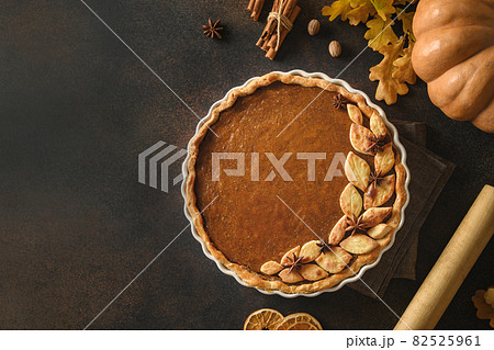 Homemade tasty pumpkin pie with ingredients for Thanksgiving Day. Homemade tasty pumpkin pie with ingredients for Thanksgiving Day. 82525961