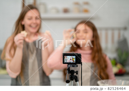 Close up camera is using by family for online live streaming during cooking in the kitchen 82526464