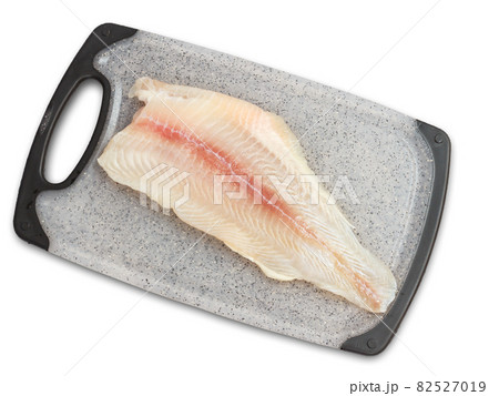 Fillet of raw pangasius fish on cutting board 82527019