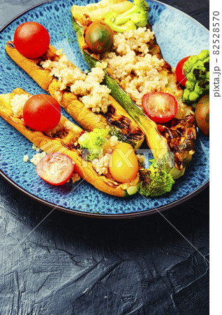 Zucchini boats with broccoli and quinoa. Zucchini boats with broccoli and quinoa. 82528570