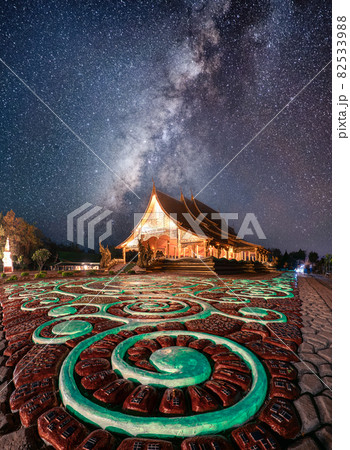 Wat Sirindhorn Wararam Temple or Wat Phu Prao with milky way glowing over illuminated church in the night at Ubon Ratchathani Wat Sirindhorn Wararam Temple or Wat Phu Prao with milky way glowing over illuminated church in the night at Ubon Ratchathani 82533988