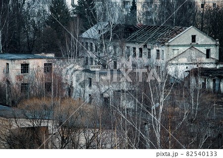 View of the gloomy abandoned buildings of the old factory 82540133