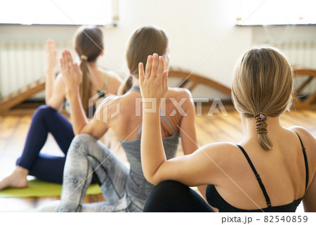 Group of people doing yoga exercise in class Group of people doing yoga exercise in class 82540859