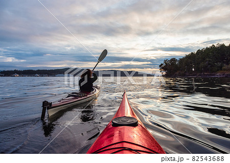 Adventurous Woman on Sea Kayak paddling in the Pacific Ocean. 82543688