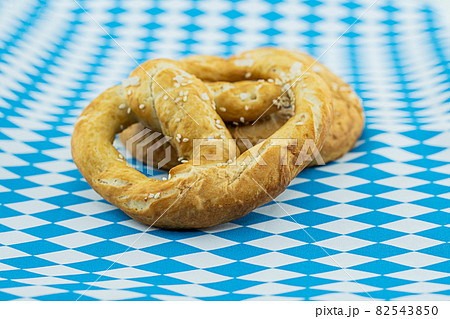 pretzel freshly baked oktoberfest symbol on white and blue background, flag of bavaria pretzel freshly baked oktoberfest symbol on white and blue background, flag of bavaria 82543850