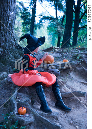 Girl in a witch costume. Beautiful picture for Halloween Girl in a witch costume. Beautiful picture for Halloween 82547242