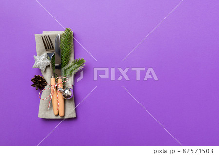 Christmas table place setting with knife, napkin and fork. Holidays new year background with copy space 82571503