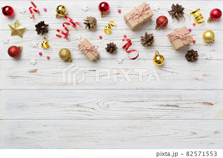 New Year composition. Christmas decor background with pine cones. Top view with copy space 82571553