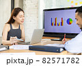 Businesspeople smiling coworking and showing growth graphic and taking a business.Asian business people group present and review financial marketing strategy business plan in meeting room together. 82571782