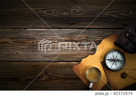 Columbus Day. Vintage discovery equipment with copy space on dark wooden background. 82572074
