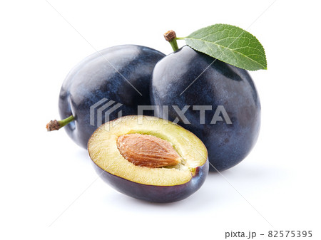Ripe plums on white background Ripe plums on white background 82575395