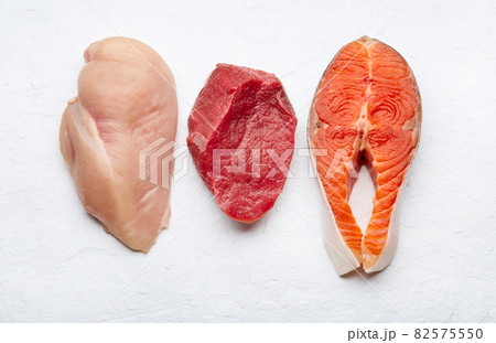 Healthy keto eating. Chicken, salmon, beef on white background Healthy keto eating. Chicken, salmon, beef on white background 82575550
