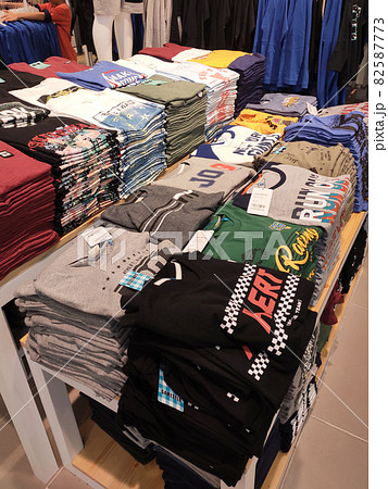 SELANGOR, MALAYSIA - MARCH 29, 2021: Selected focused on children's clothing being sold in a supermarket. Has a price tag. Sorted by brand, type, size, and age. SELANGOR, MALAYSIA - MARCH 29, 2021: Selected focused on children's clothing being sold in a supermarket. Has a price tag. Sorted by brand, type, size, and age. 82587773
