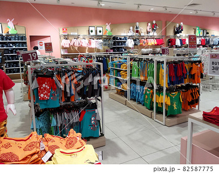 SELANGOR, MALAYSIA - MARCH 29, 2021: Selected focused on children's clothing being sold in a supermarket. Has a price tag. Sorted by brand, type, size, and age. SELANGOR, MALAYSIA - MARCH 29, 2021: Selected focused on children's clothing being sold in a supermarket. Has a price tag. Sorted by brand, type, size, and age. 82587775