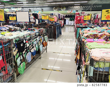 SELANGOR, MALAYSIA - MARCH 29, 2021: Selected focused on children's clothing being sold in a supermarket. Has a price tag. Sorted by brand, type, size, and age. SELANGOR, MALAYSIA - MARCH 29, 2021: Selected focused on children's clothing being sold in a supermarket. Has a price tag. Sorted by brand, type, size, and age. 82587783