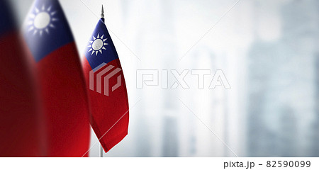 Small flags of Taiwan on a blurry background of the city Small flags of Taiwan on a blurry background of the city 82590099