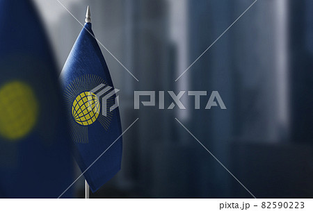 Small flags of Commonwealth on a blurry background of the city 82590223