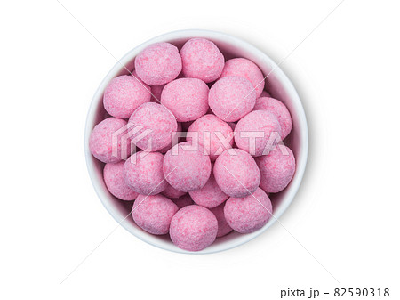 Round Sweet Strawberry Raspberry Bonbons candies in white ceramic plate on white background. Round Sweet Strawberry Raspberry Bonbons candies in white ceramic plate on white background. 82590318