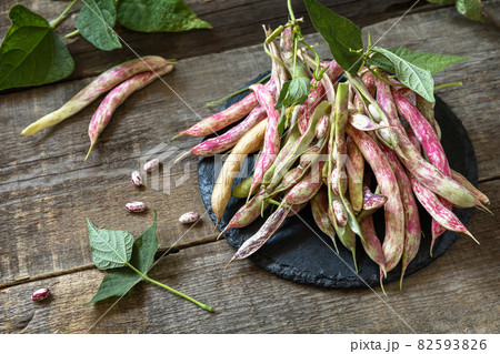 Beans of bean, brown bean (of dried beans) bunch harvest on a rustic table. Food background. Beans of bean, brown bean (of dried beans) bunch harvest on a rustic table. Food background. 82593826