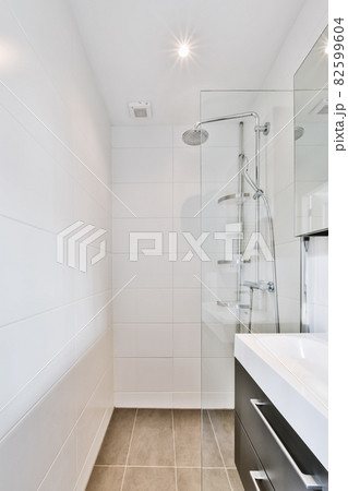 Modern shower stall in a bright bathroom 82599604