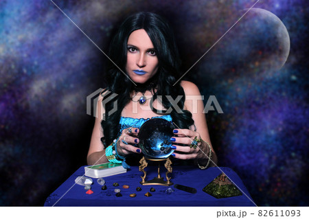 Psychic with crystal ball and tarot cards Bright Galaxy Background 82611093