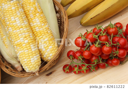 Tomatoes and Corn on Table For Sale in Organic Market 82611222