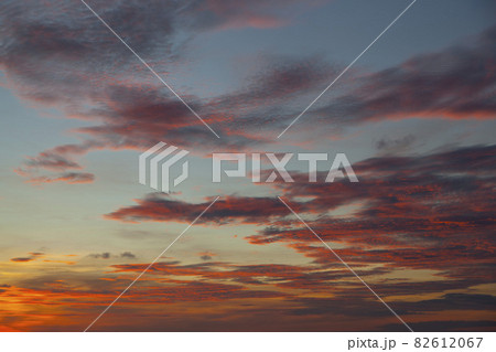 Pink sunset sky background. Picturesque colorful red clouds in the sky. Vast sky landscape, sunset sky view. 82612067