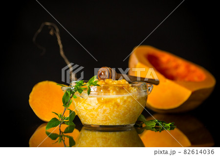 sweet boiled pumpkin porridge in a bowl with honey 82614036